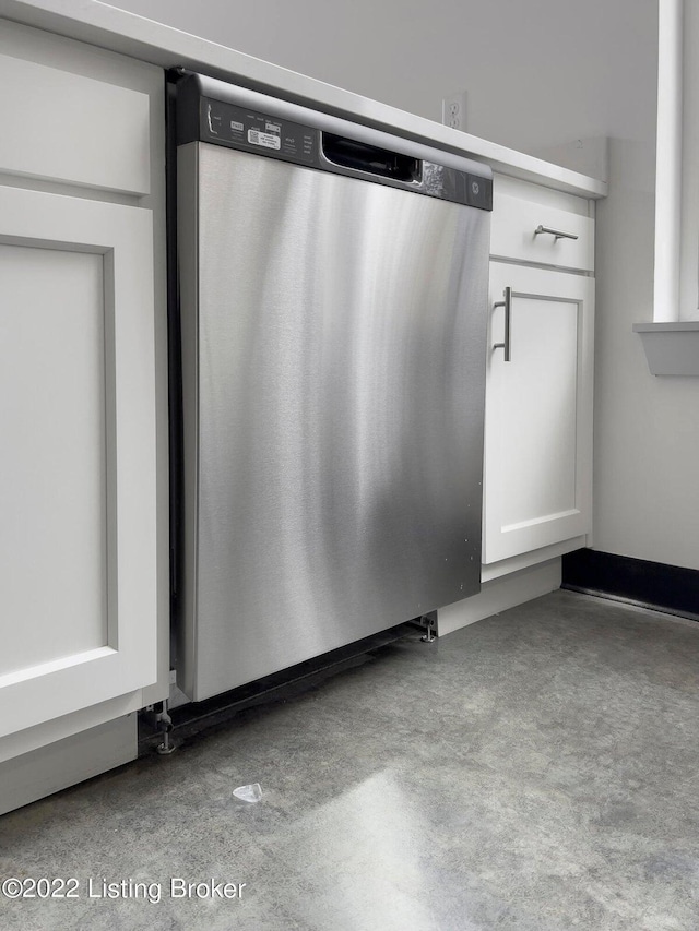 room details featuring white cabinets and stainless steel dishwasher