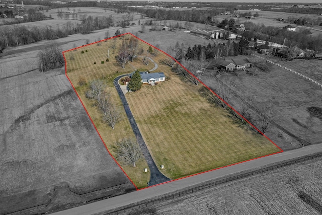 birds eye view of property featuring a rural view