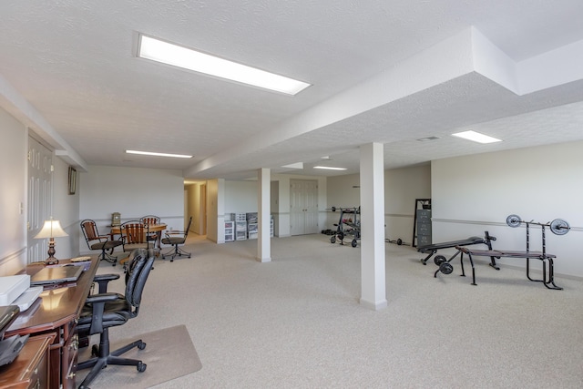 office space featuring a textured ceiling and carpet flooring