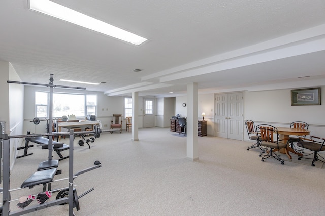 exercise room featuring a textured ceiling