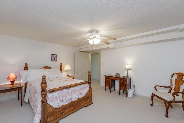 bedroom with a textured ceiling, ceiling fan, baseboards, and light colored carpet