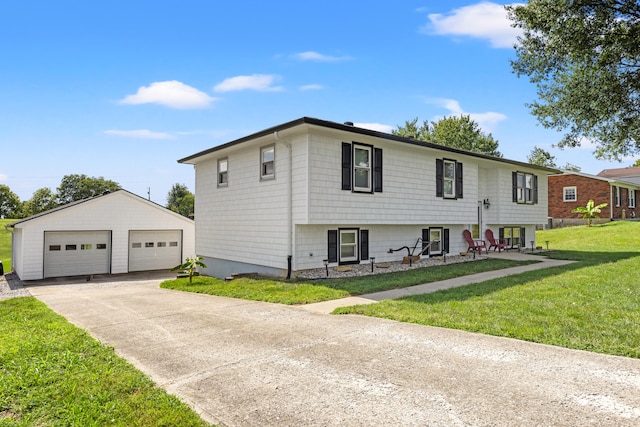 view of front of house with an outbuilding, a detached garage, and a front yard