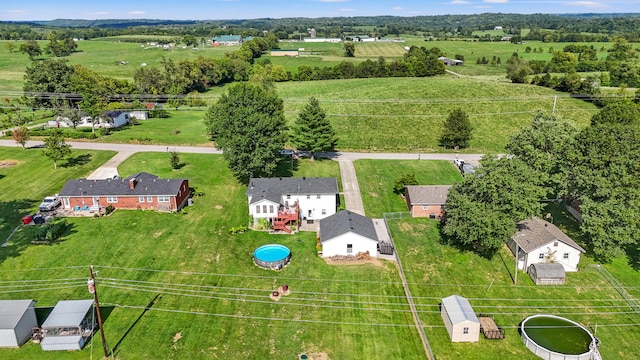 birds eye view of property featuring a rural view