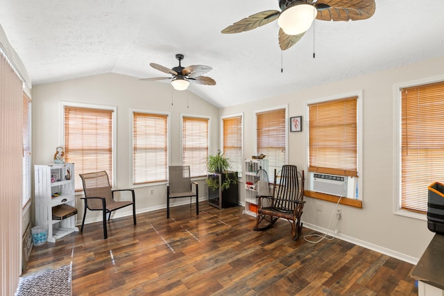 living area featuring lofted ceiling, wood finished floors, a textured ceiling, and cooling unit