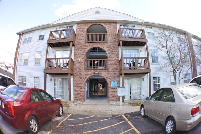 view of property featuring uncovered parking