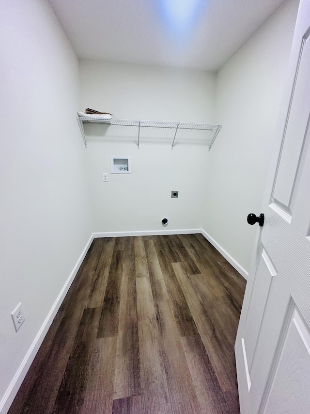 laundry area with laundry area, hookup for a washing machine, baseboards, and hookup for an electric dryer