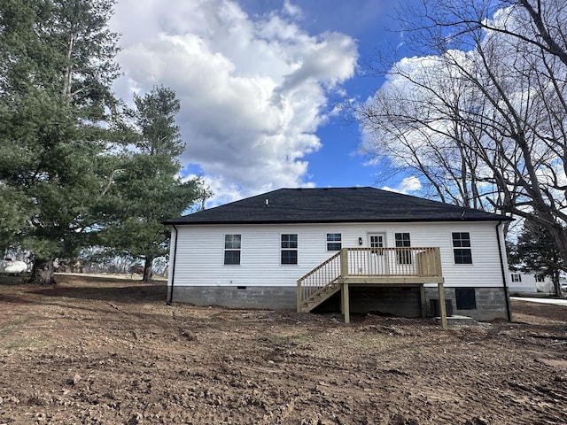 back of house featuring a shingled roof, crawl space, stairway, and a wooden deck