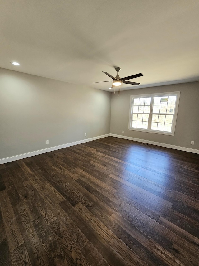 empty room featuring dark wood-style floors, baseboards, a ceiling fan, and recessed lighting