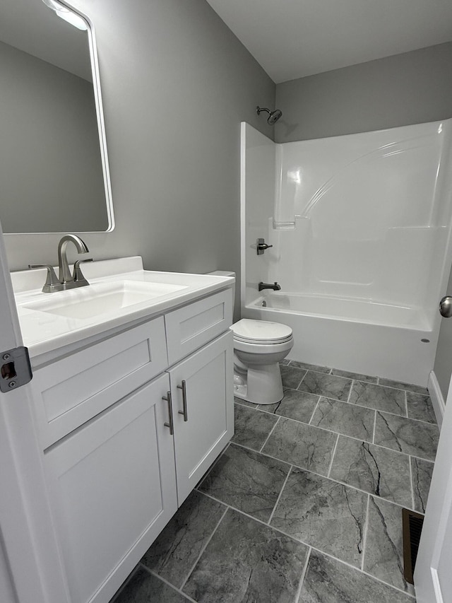 full bathroom featuring toilet, vanity, and shower / tub combination