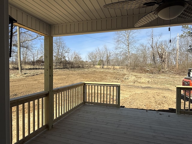 wooden deck featuring ceiling fan