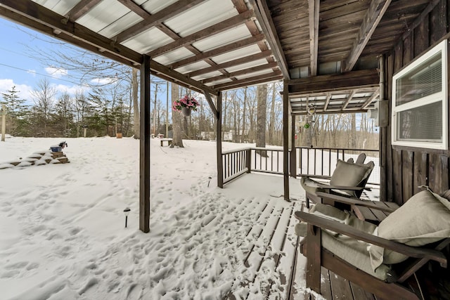 view of snow covered deck