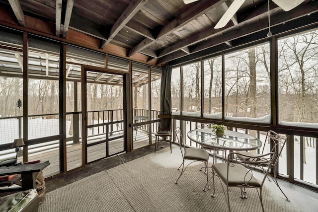 unfurnished sunroom with wood ceiling