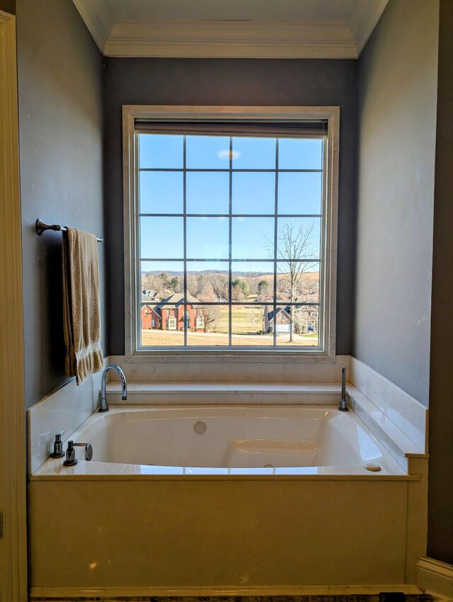 full bath with a garden tub and crown molding