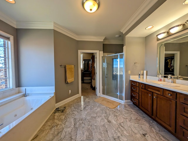 full bathroom with a stall shower, a walk in closet, vanity, and baseboards