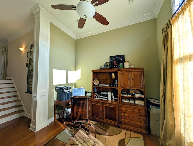 office area featuring crown molding, baseboards, and wood finished floors