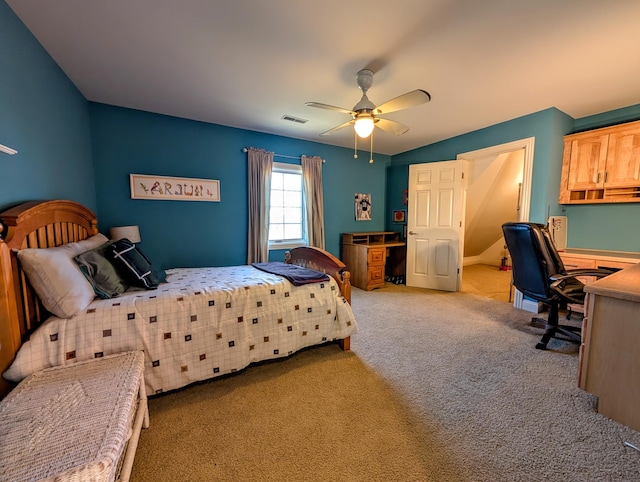 bedroom with carpet, visible vents, and ceiling fan