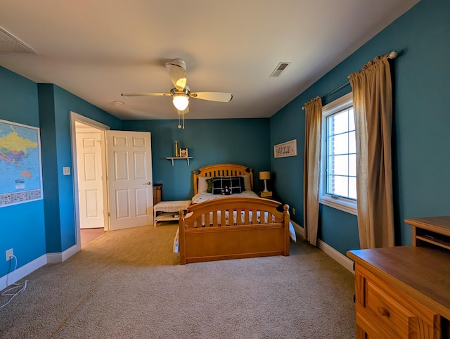 carpeted bedroom featuring baseboards, visible vents, and ceiling fan