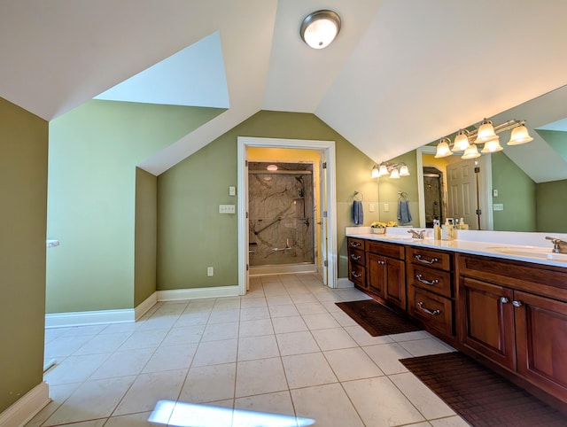 full bath with a stall shower, vaulted ceiling, a sink, and double vanity