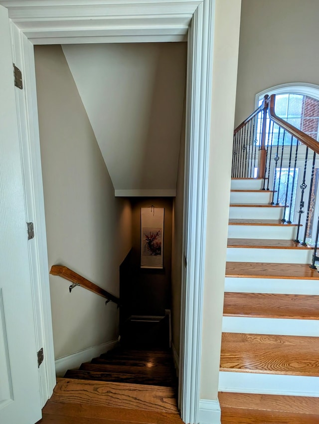 stairway featuring baseboards