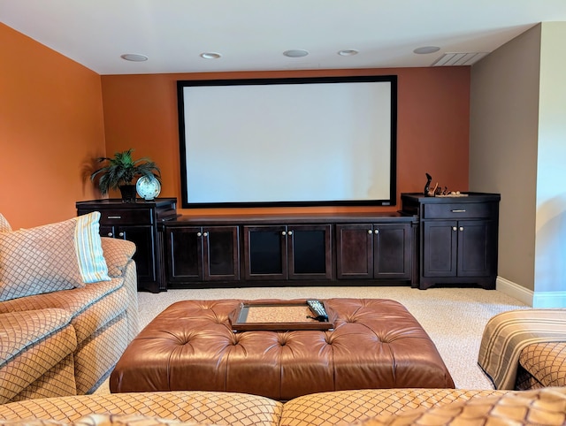 cinema featuring baseboards, visible vents, and light colored carpet