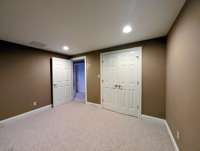 unfurnished bedroom with recessed lighting, carpet flooring, visible vents, and baseboards