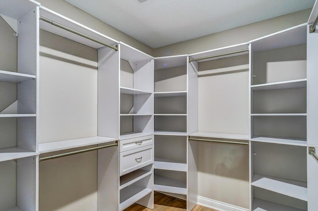 spacious closet with wood finished floors