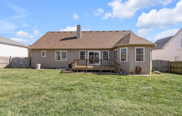 back of house featuring a lawn, a fenced backyard, a chimney, a gate, and a deck