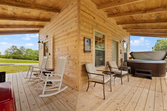 wooden terrace with a hot tub