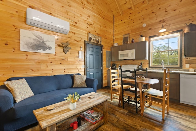 living area with a wall unit AC, dark wood-type flooring, wood walls, and high vaulted ceiling