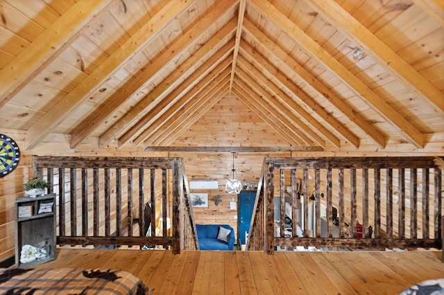 unfurnished bedroom featuring wooden ceiling, vaulted ceiling with beams, and wood walls