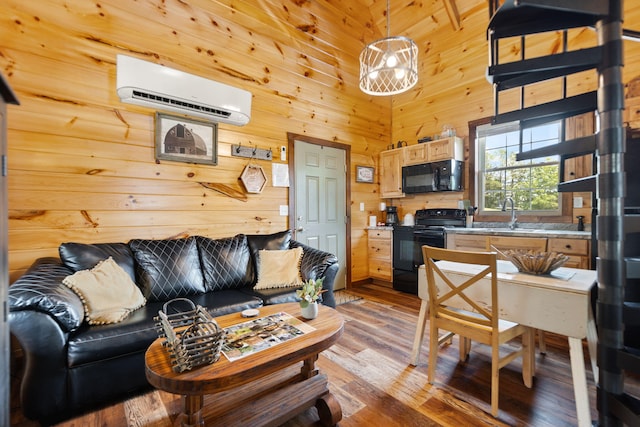 living room featuring wooden walls, a towering ceiling, light wood-type flooring, and a wall mounted air conditioner