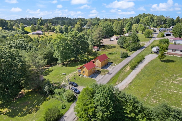 bird's eye view featuring a wooded view