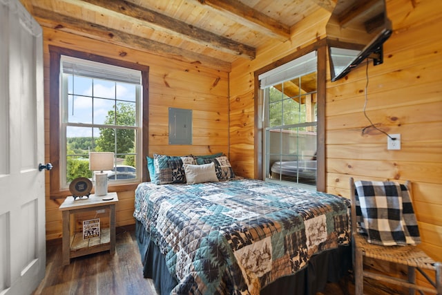 bedroom with beam ceiling, wooden walls, wooden ceiling, and dark wood-style flooring