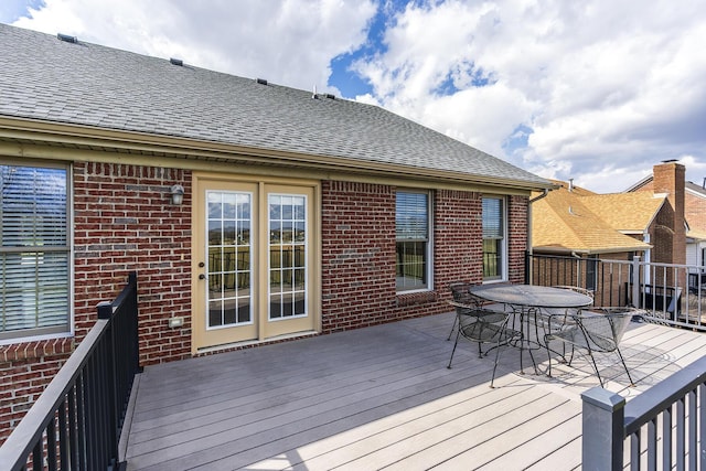 wooden deck with outdoor dining area