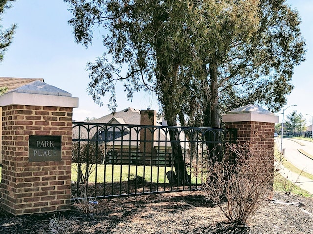 view of gate featuring fence