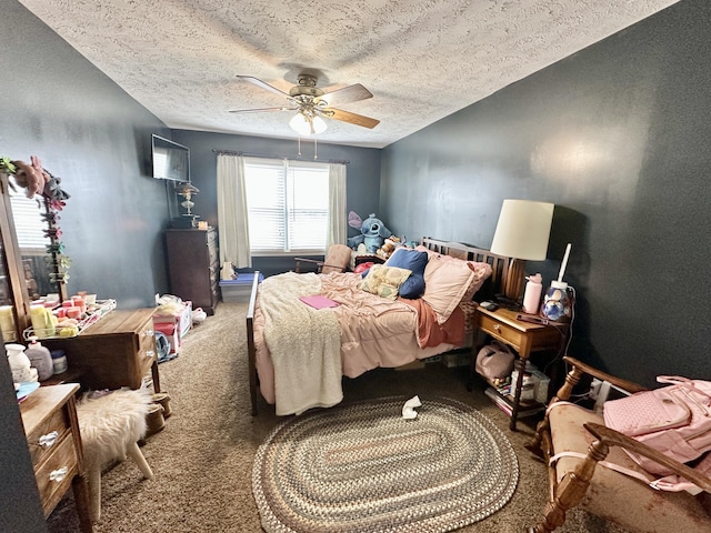 bedroom featuring carpet floors, ceiling fan, and a textured ceiling