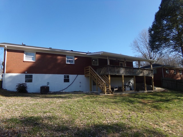 back of house featuring brick siding, a patio, a yard, central air condition unit, and stairway