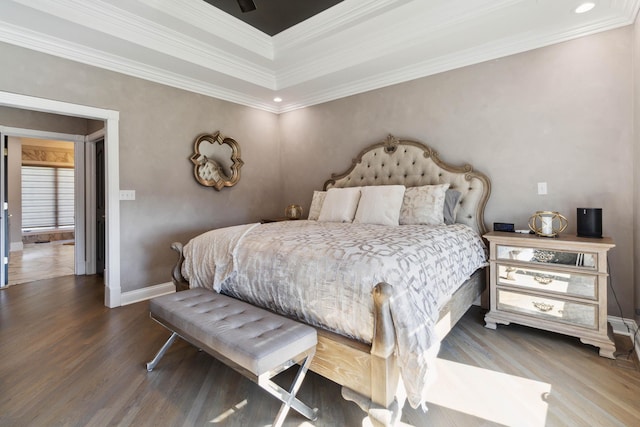 bedroom with crown molding, baseboards, and wood finished floors