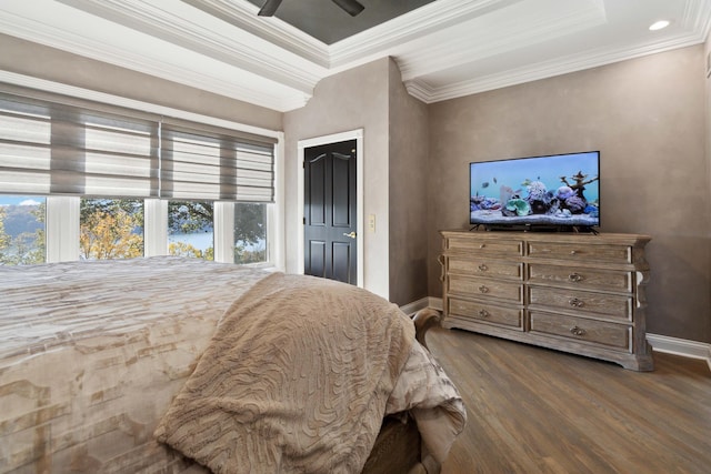 bedroom featuring ceiling fan, ornamental molding, wood finished floors, and baseboards