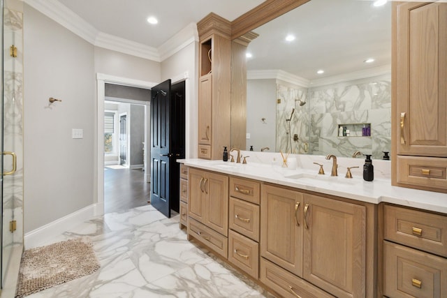 full bath featuring crown molding, a stall shower, marble finish floor, and a sink