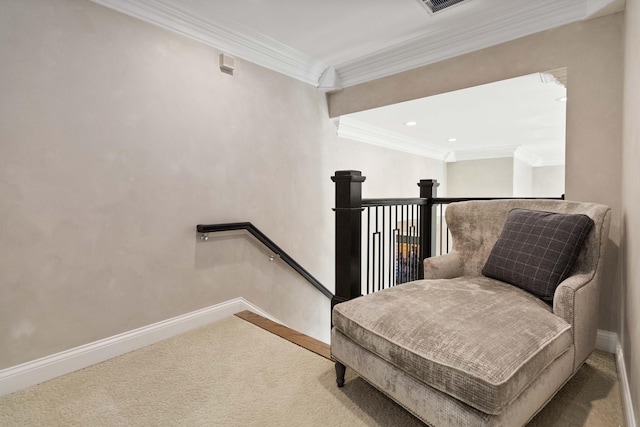 living area with carpet, baseboards, crown molding, and an upstairs landing