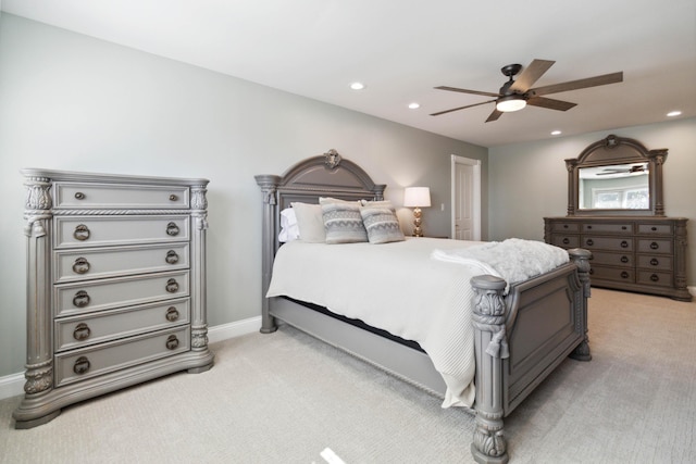 bedroom with a ceiling fan, recessed lighting, light colored carpet, and baseboards