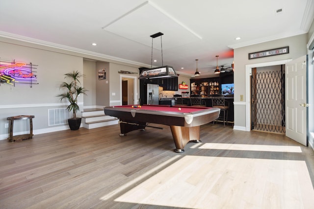 playroom with crown molding, recessed lighting, wood finished floors, bar area, and billiards