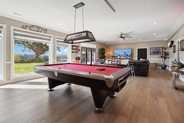 playroom with ornamental molding, recessed lighting, visible vents, and hardwood / wood-style flooring