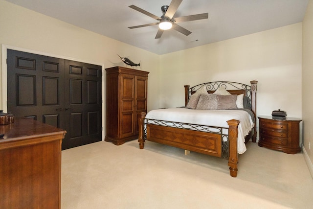 bedroom featuring light carpet and ceiling fan