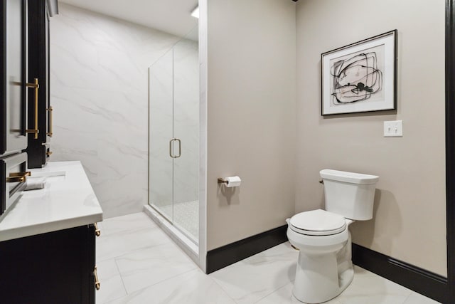 full bathroom with a marble finish shower, baseboards, toilet, marble finish floor, and vanity