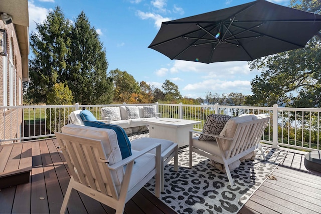 wooden deck featuring an outdoor hangout area