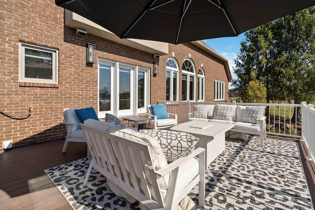 wooden deck with an outdoor hangout area