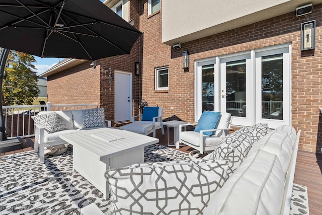 deck with an outdoor living space and french doors