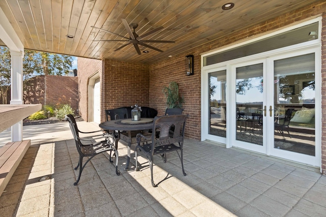 view of patio with ceiling fan, french doors, and outdoor dining space